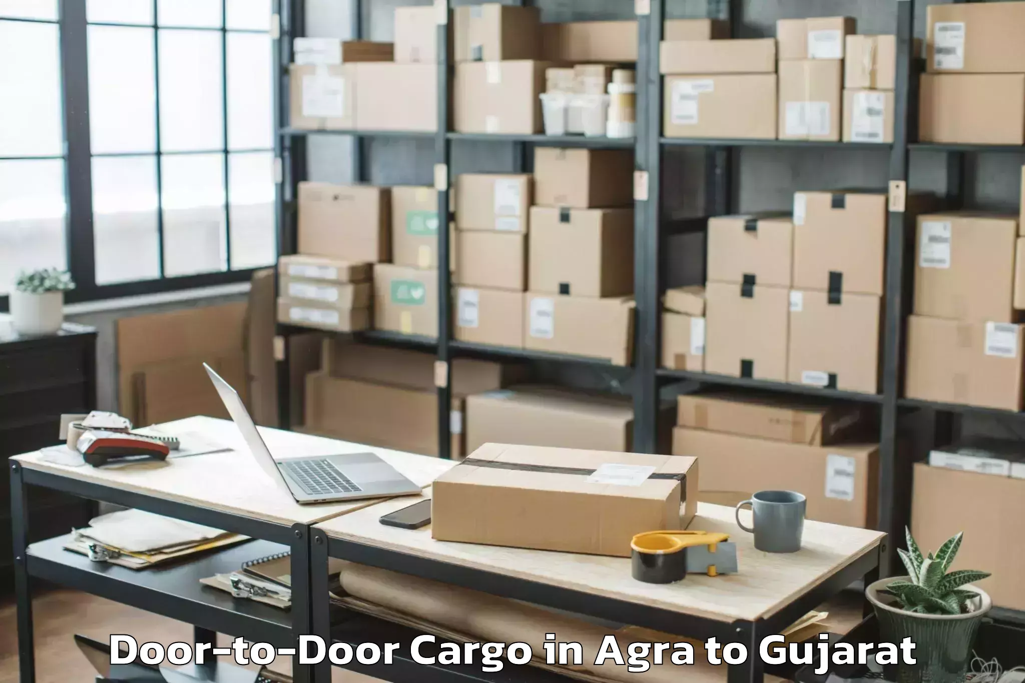 Comprehensive Agra to Kadi Sarva Vishwavidyalaya Gan Door To Door Cargo